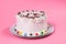 Tasty creamy birthday cake colorful candy adorned