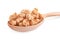 Tasty crispy granola in wooden spoon on background, closeup