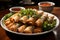 tasty crispy spring rolls with red chutney on plate