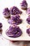 Tasty cupcakes made of purple cream for fat thursday