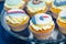 tasty cupcakes for thematic sea birthday party with sugar mastic waves and ship