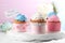 Tasty cupcakes and topper pick with words HAPPY MOTHER\'S DAY on stand