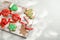 Tasty decorated Christmas cookies on wooden board,