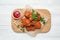 Tasty deep fried chicken pieces served on white wooden table, top view