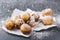 Tasty deep fried donut holes sprinkling with powdered sugar.Delicious sweet cheese balls