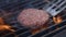 Tasty delicious burger patty flipped on hot seared grill pan overhead. A cook is preparing a burger cutlet. Grills meat