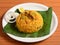 Tasty and delicious Prawns biryani served in a banana leaf, selective focus