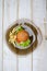 Tasty dinner with fast food. Burger with eggs, tomato, salad and