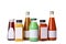 Tasty drinks in bottles with blank labels on white background