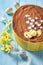 Tasty easter Cheesecake decorated with yellow daffodils