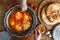 Tasty family breakfast with shakshuka, bread and hummus. Rustic style