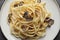 Tasty fettuccine with truffle on plate, closeup. Top view
