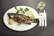 Tasty fish with lemon and white wine, Grilled fish dish