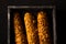 Tasty food. French crisply baguette close-up on a black background