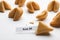 Tasty fortune cookies with prediction Dream BIG on white background