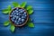 Tasty fresh bilberries with green leaves top view. Generate Ai