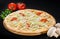 Tasty fresh Caesar pizza with mozzarella and parmesan cheeses, c