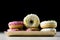 Tasty and fresh donuts on the kitchen table. Cookies, tasty snacks on a wooden table. Table in kuchi.