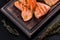 Tasty fresh red fish arctic char baked on a grill