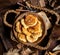 Tasty fried russian pancakes with powdered sugar on top in wooden bowl