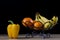 Tasty fruits in a metal basket. Wire basket with fruits on a woo