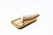 A tasty goat cheese roll atop a wooden cutting board over white background