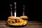 Tasty gourmet delicous burgers on black plate