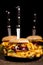 Tasty gourmet delicous burgers on black plate