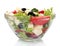Tasty greek salad in transparent bowl