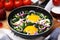 Tasty green Shakshouka served on table, closeup