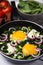 Tasty green Shakshouka served on white wooden table, closeup