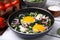 Tasty green Shakshouka served on white wooden table, closeup