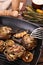 Tasty grilled artichokes on table, closeup view