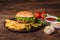 Tasty grilled homemade burger with beef, tomato, cheese, cucumber and lettuce