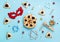 Tasty hamantaschen cookies, red carnival mask, noisemaker, sweet candies and party decor on blue background.