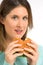 Tasty hamburger - woman enjoying fast food