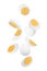 Tasty hard boiled eggs falling on white background