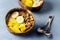 Tasty and Healthy Breakfast in Coconut Bowls Granola With Yogurt Banana and Mango Top View Horizontal Copy Space