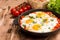 Tasty and Healthy Shakshuka in a Frying Pan. Fried eggs with tom