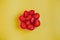 Tasty and healthy snack, crispbread with strawberry slices on a yellow background