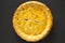 Tasty Homemade Canadian Tourtiere Meat Pie on a black background, top view. Flat lay, overhead, from above. Close-up