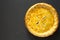 Tasty Homemade Canadian Tourtiere Meat Pie on a black surface, top view. Flat lay, overhead, from above. Space for text