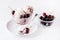 Tasty Homemade Cherry Ice Cream in Glass Bowl Tasty Homemade Ice Cream decorated with Cherry White Background