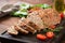 Tasty homemade ground baked turkey meatloaf on wooden table.