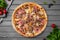 Tasty hot italian pizza with chicken, ham, ground beef, mushrooms and cheese. Pizzeria menu.