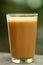 Tasty and hot milk masala tea in old glass