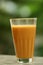 Tasty and hot milk masala tea in old glass