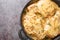 Tasty hot Southern Smothered Pork Chops in Brown cream onion Gravy  closeup on the pan. Horizontal top view