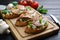 Tasty Italian bruschetta with grilled chicken, ricotta and basil