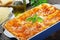 Tasty italian lasagna in dish, close-up